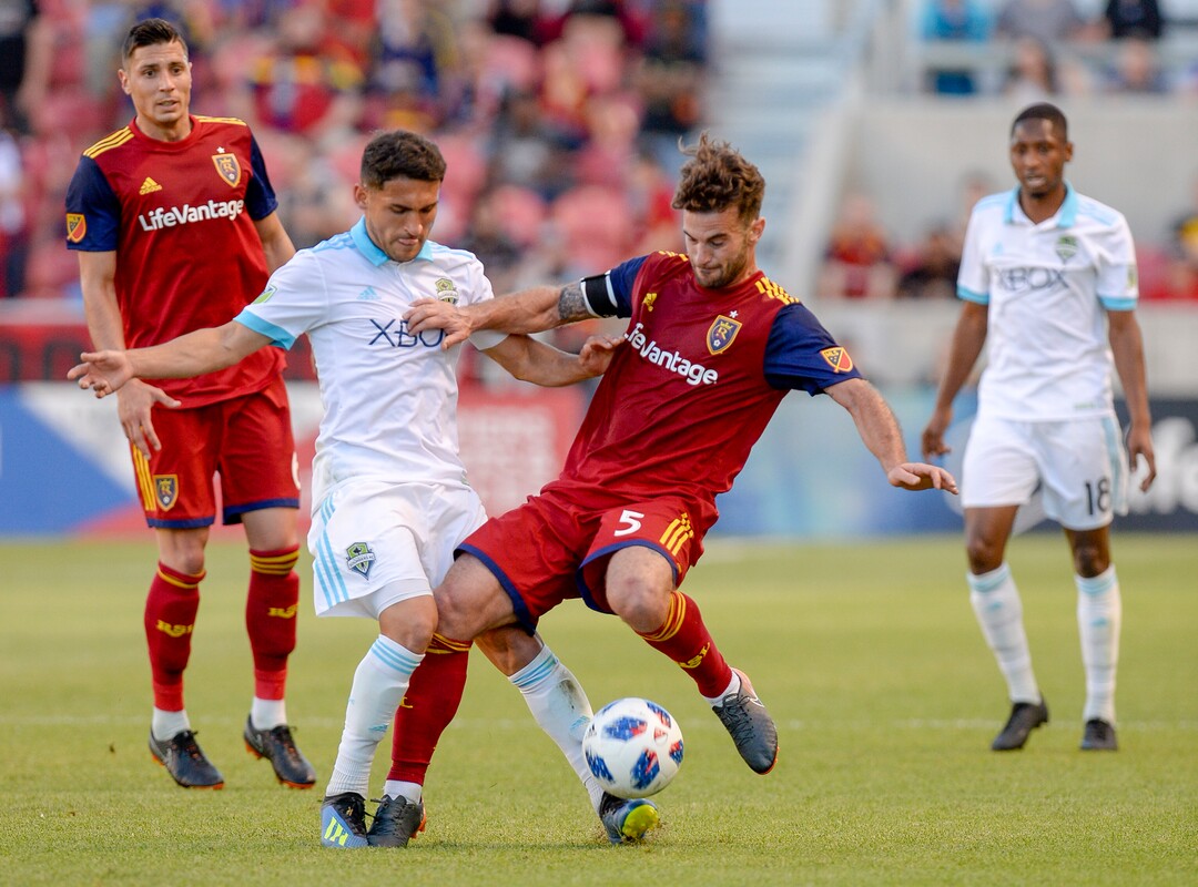 Leah Hogsten  |  The Salt Lake Tribune  Seattle Sounders midfielder Cristian Roldan (7) battles Real Salt Lake midfielder Kyle Beckerman (5) as Real Salt Lake hosts the Seattle Sounders at Rio Tinto Stadium in Sandy, Utah, Saturday, June 2, 2018.