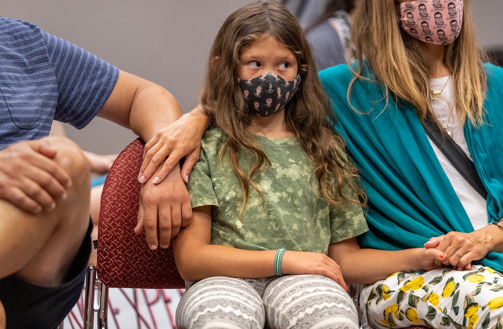 (Leah Hogsten | The Salt Lake Tribune) "What if our message doesn't get through," asked Zemirah Grossman of attorney Greg Skordas at Monday's press conference, who told her the group would need a "better lawyer." Grossman, 9, sits between her father Nate and mother Maurena Grossman. A group of Utah parents is suing the state for its ban on school districts enacting their own mask mandates which they say leaves their kids unnecessarily unprotected and at-risk from COVID-19 in the classroom, Aug. 23, 2021.