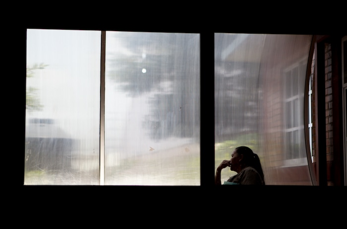 In this Aug. 15, 2007 photo, a woman sits in front of a window inside a nursing school in Nezahualcoyotl, Mexico state. The nonprofit Citizen Observatory Against Gender Violence, Disappearance and Femicides in Mexico State counted 263 femicides in 2016 alone. Before Mexico State, it was Ciudad Juarez, across the border from El Paso, Texas, that was notorious for killings of women, with nearly 400 slain there since 1993 and only a handful of cases resulting in convictions. (AP Photo/Rebecca Blackwell)