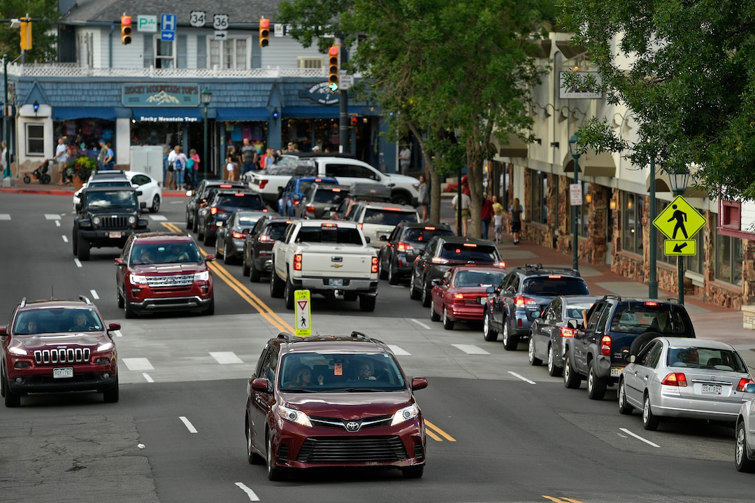 (Helen H. Richardson  |  The Denver Post) Cars sit in traffic as they wait to get onto West Elkhorn Ave from Moraine Ave on August 5, 2018, in Estes Park, Colorado. The popular town is overrun with tourists in the summer who come to visit and explore close nearby Rocky Mountain National Park. 