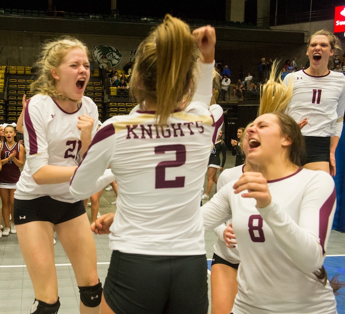 (Rick Egan  |  The Salt Lake Tribune)    The Lone Peak Knights celebrate their win over the Pleasant Grove Vikings, for the 6A volleyball championship, at Utah Valley University, Saturday, November 4, 2017.