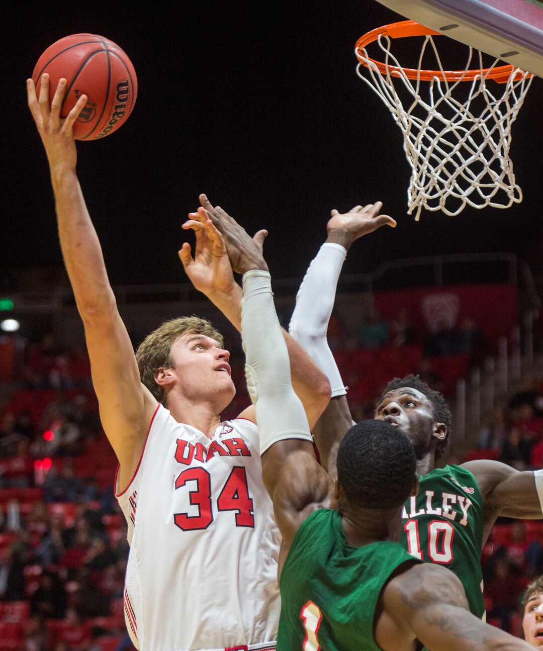 (Rick Egan  |  The Salt Lake Tribune)    Utah Utes center Jayce Johnson (34) shoots over Mississippi Valley State Delta Devils center Emmanuel Ejeh (10), and forward Dante Scott (1), in basketball action between Utah Utes and Mississippi Valley State Delta Devils at the Jon M. Huntsman Center, Thursday, Nov. 15, 2018.