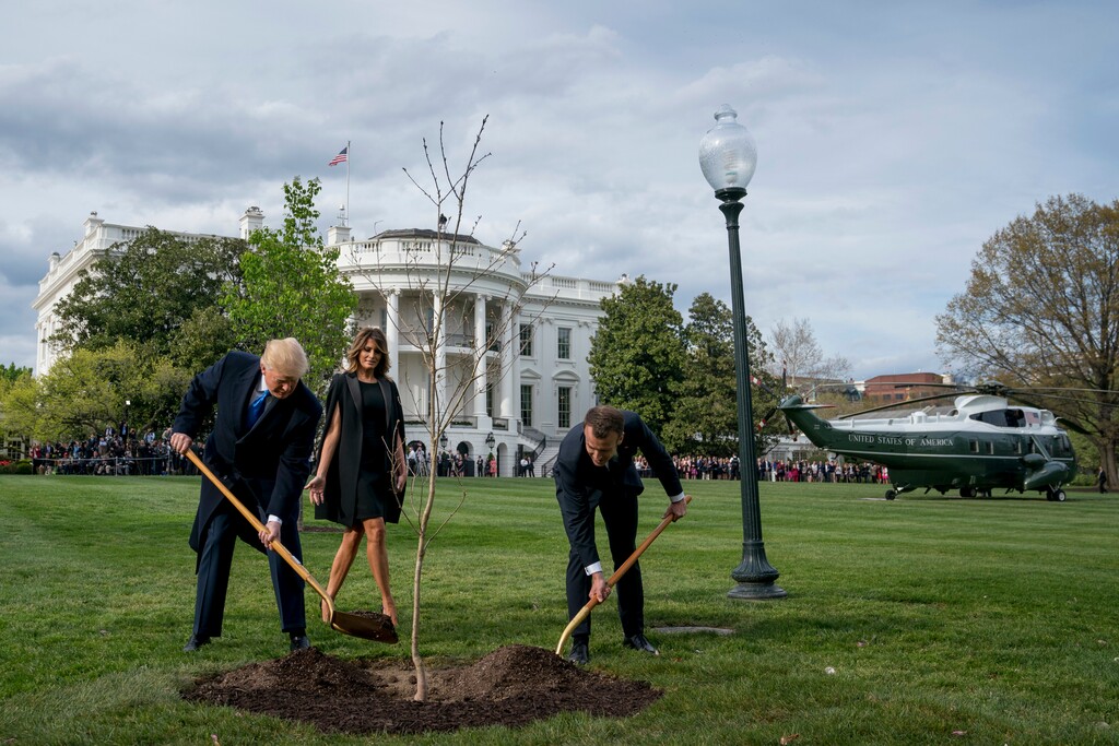 First lady Melania Trump watches as President Donald Trump and French President Emmanuel Macron participate in a tree planting ceremony on the South Lawn of the White House in Washington, Monday, April 23, 2018. (AP Photo/Andrew Harnik)