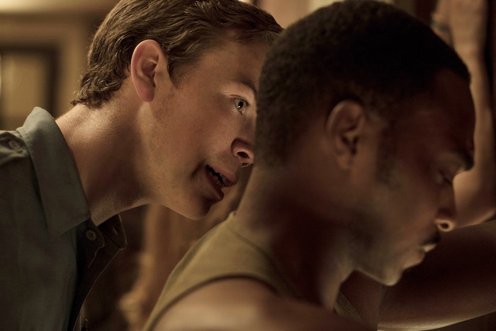 This image released by Annapurna Pictures shows Will Poulter, left, and Anthony Mackie in a scene from "Detroit." (Francois Duhamel/Annapurna Pictures via AP)