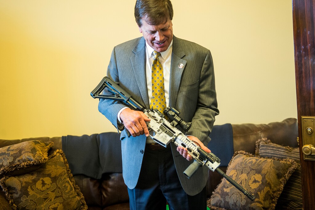 Chris Detrick  |  The Salt Lake TribuneRep. Keven J. Stratton (R-Orem) holds the 5th commemorative Legislative gun, an AR-15 5.56, in Rep. Curtis Oda's (R-Clearfield) office at the Utah State Capitol Tuesday February 3, 2015.   