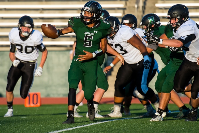 (Chris Detrick  |  The Salt Lake Tribune)    Hillcrest's Tyson Flores (5) passes the ball during the game at Hillcrest High School Friday, September 1, 2017. 