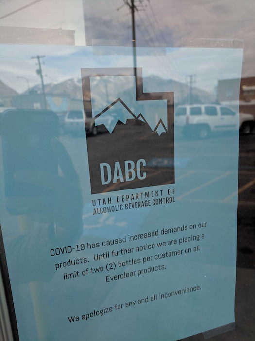 (Leah Hogsten | The Salt Lake Tribune) A sign hangs on the door of an Ogden liquor store on Friday, March 13, 2020, alerting customers of purchasing restrictions on bottles of Everclear. As hand sanitizer becomes harder to find amid the coronavirus outbreak, many have started using the high-proof spirit to make their own disinfectant.