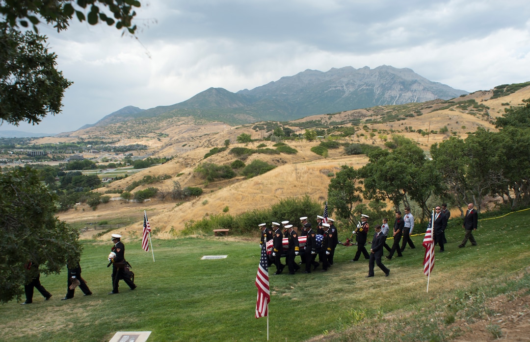 (Rick Egan  |  The Salt Lake Tribune)  The casket carrying Matthew Burchett is carried by the pall bearers at East Lawn Memorial Hills Cemetery in Provo, Monday, Aug. 20, 2018.