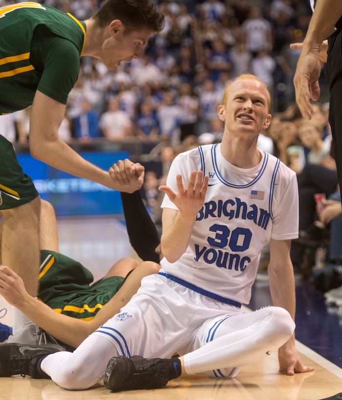 (Rick Egan  |  The Salt Lake Tribune)  Brigham Young Cougars guard TJ Haws (30) pleads with the referee after being call for a foul going for a loose ball, in basketball action at the Marriott Center, Saturday, February 10, 2018.