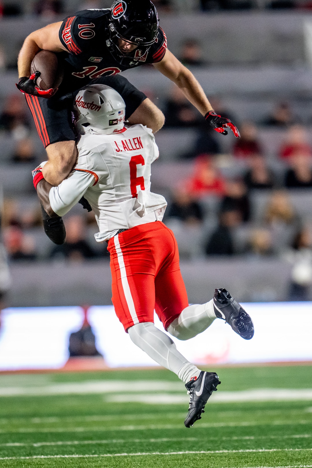 (Trent Nelson  |  The Salt Lake Tribune) Utah Utes tight end Hunter Andrews (10) leaps over Houston Cougars defensive back Jordan Allen (6) Utah hosts Houston, NCAA football at Rice-Eccles Stadium in Salt Lake City on Saturday, Oct. 24, 2026.