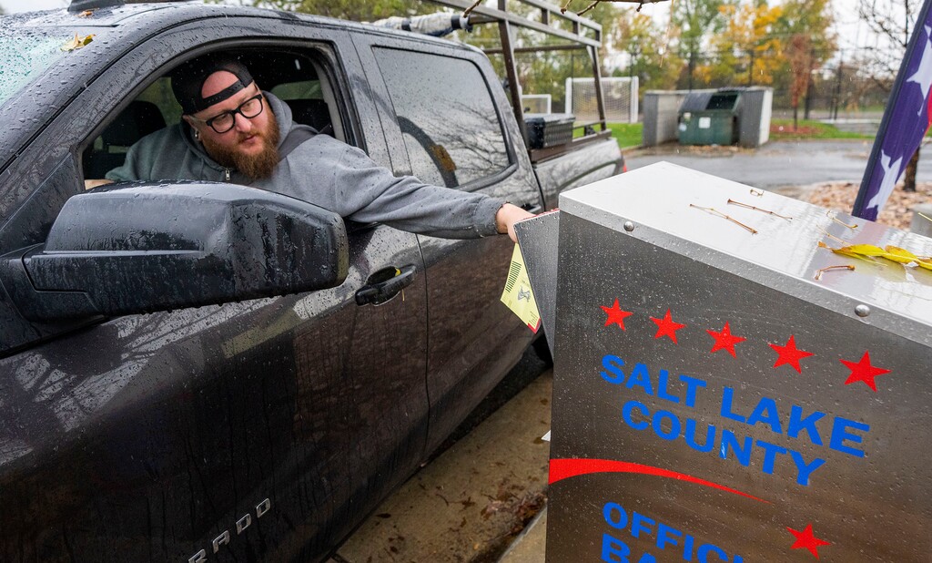 (Rick Egan | The Salt Lake Tribune) Brett Jensen drops his ballot in the drop box at the River's Bend Senior Center, on Tuesday, Nov. 2, 2021.