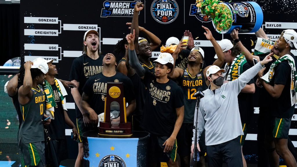 Baylor players and coaches celebrate after the championship game against Gonzaga in the men's Final Four NCAA college basketball tournament, Monday, April 5, 2021, at Lucas Oil Stadium in Indianapolis. Baylor won 86-70. (AP Photo/Darron Cummings)