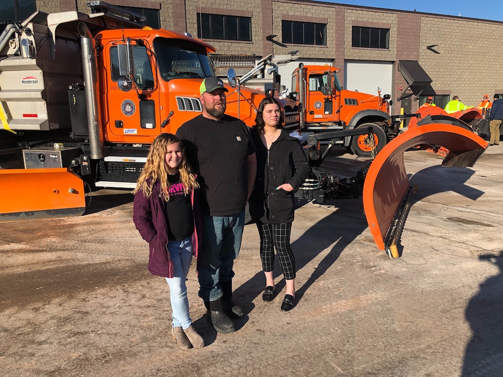 (Lee Davidson | The Salt Lake Tribune) Snowplow driver Jake Brown and his daughters Korie, 10, and Tayah, 20, talk about how he has spent the past eight straight Christmas days clearing roads. They talked to reporters at a Utah Department of Transportation facility in Cottonwood Heights on Thursday, Dec. 19, 2019.