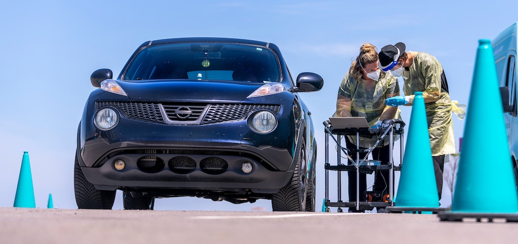 (Leah Hogsten | The Salt Lake Tribune) A registered nurse and a clinical assistant get nasal swabs and information from a family of four at the Nomi Health COVID-19 testing site in the parking lot of Amazon Friday, June 10, 2022 in Salt Lake City