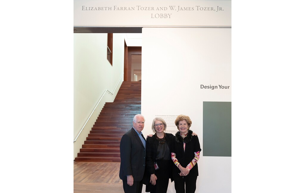 (Utah Museum of Fine Arts) Gretchen Dietrich, center, director of the Utah Museum of Fine Arts, stands with W. James Tozer Jr. and Elizabeth Farrar Tozer, in the UMFA lobby that has now been named after them. The Tozers have given UMFA a $400,000 gift to endow special exhibitions, the museum announced on Feb. 23, 2022.