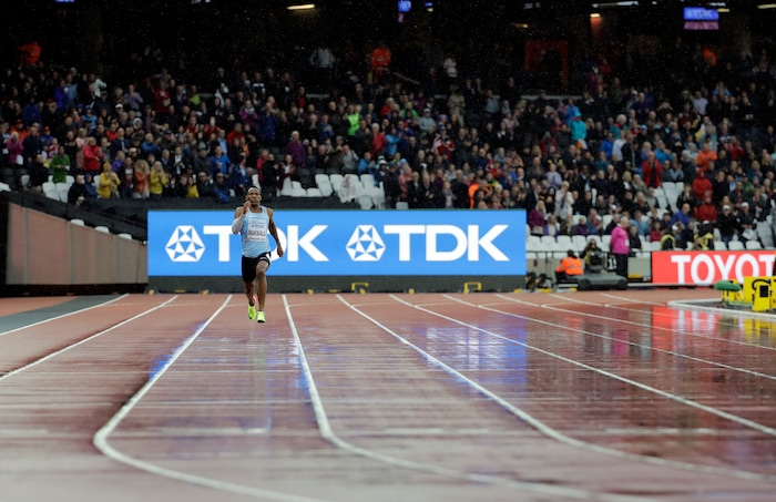 Botswana's Isaac Makwala races alone in a Men's 200m individual time trial during the World Athletics Championships in London Wednesday, Aug. 9, 2017. Makwala ran an individual time trial to qualify for the 200m semi-finals after he missed the 200m heats and the 400m final as he was barred from competing for 48 hours while organisers tried to halt a norovirus outbreak. (AP Photo/David J. Phillip)