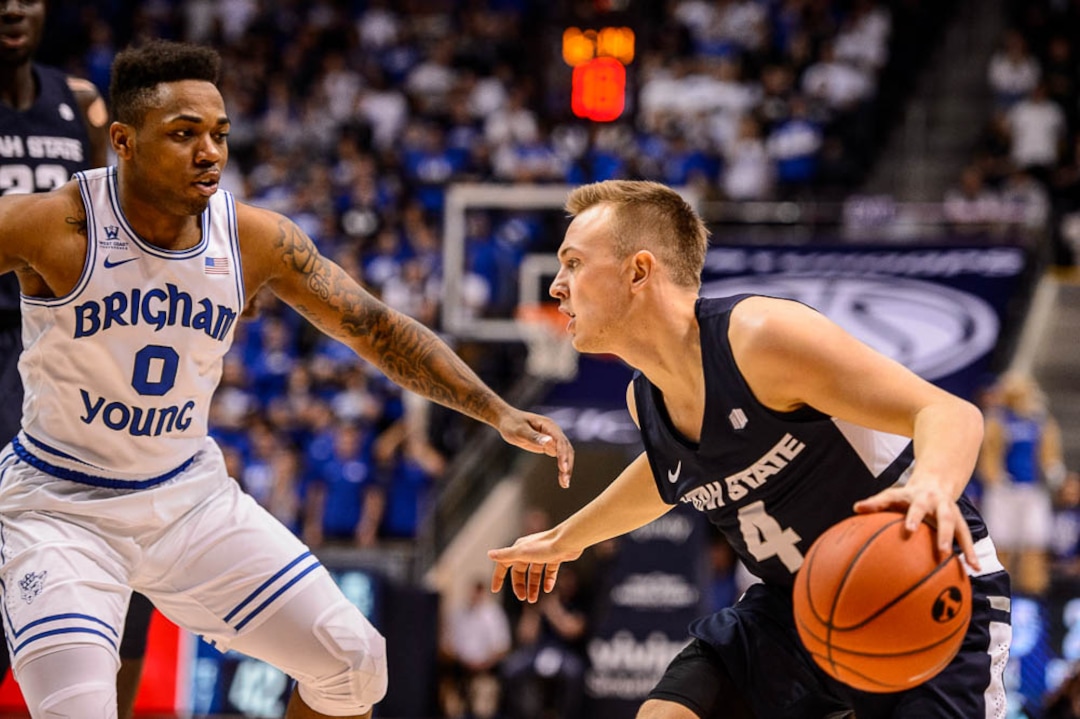 (Trent Nelson | The Salt Lake Tribune)  Brigham Young Cougars guard Jahshire Hardnett (0) and Utah State Aggies guard Crew Ainge (4) as BYU hosts Utah State, NCAA basketball in Provo on Wednesday Dec. 5, 2018.
