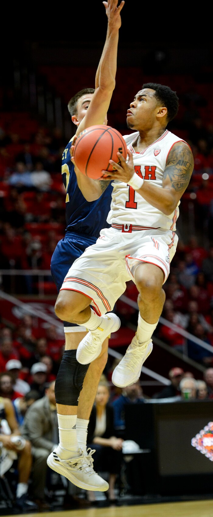 (Steve Griffin  |  The Salt Lake Tribune)  Utah Utes guard Justin Bibbins (1) leaps tot he basket during the Utah versus UC Davis men's NIT basketball game at the Huntsman Center in Salt Lake City Wednesday March 14, 2018.