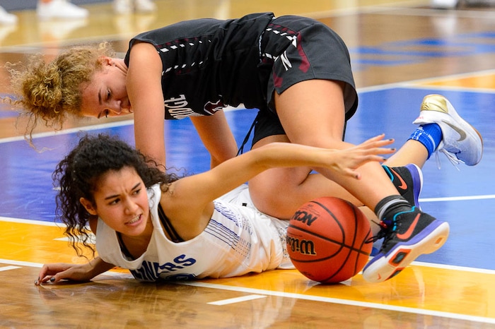 (Trent Nelson | The Salt Lake Tribune)  Northridge's Brooklyn Perkins (3) and Bingham's Ameleya Angilau (12) scramble as Bingham faces Northridge in the 6A High School Girls' Basketball Tournament at SLCC in Taylorsville, Thursday Feb. 22, 2018.