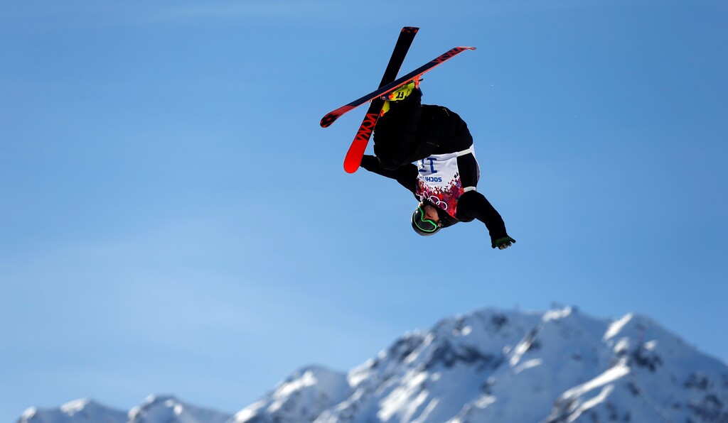 Finland's Antti Ollila is airborne during mens ski slopestyle training at the Rosa Khutor Extreme Park, at the 2014 Winter Olympics, Wednesday, Feb. 12, 2014, in Krasnaya Polyana, Russia. (AP Photo/Felipe Dana)