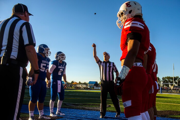 (Chris Detrick  |  The Salt Lake Tribune)  The team captains for Bingham and East watch the coin toss before the game at Bingham High School Friday, August 25, 2017. Bingham is winning the game 24-17 at halftime. 