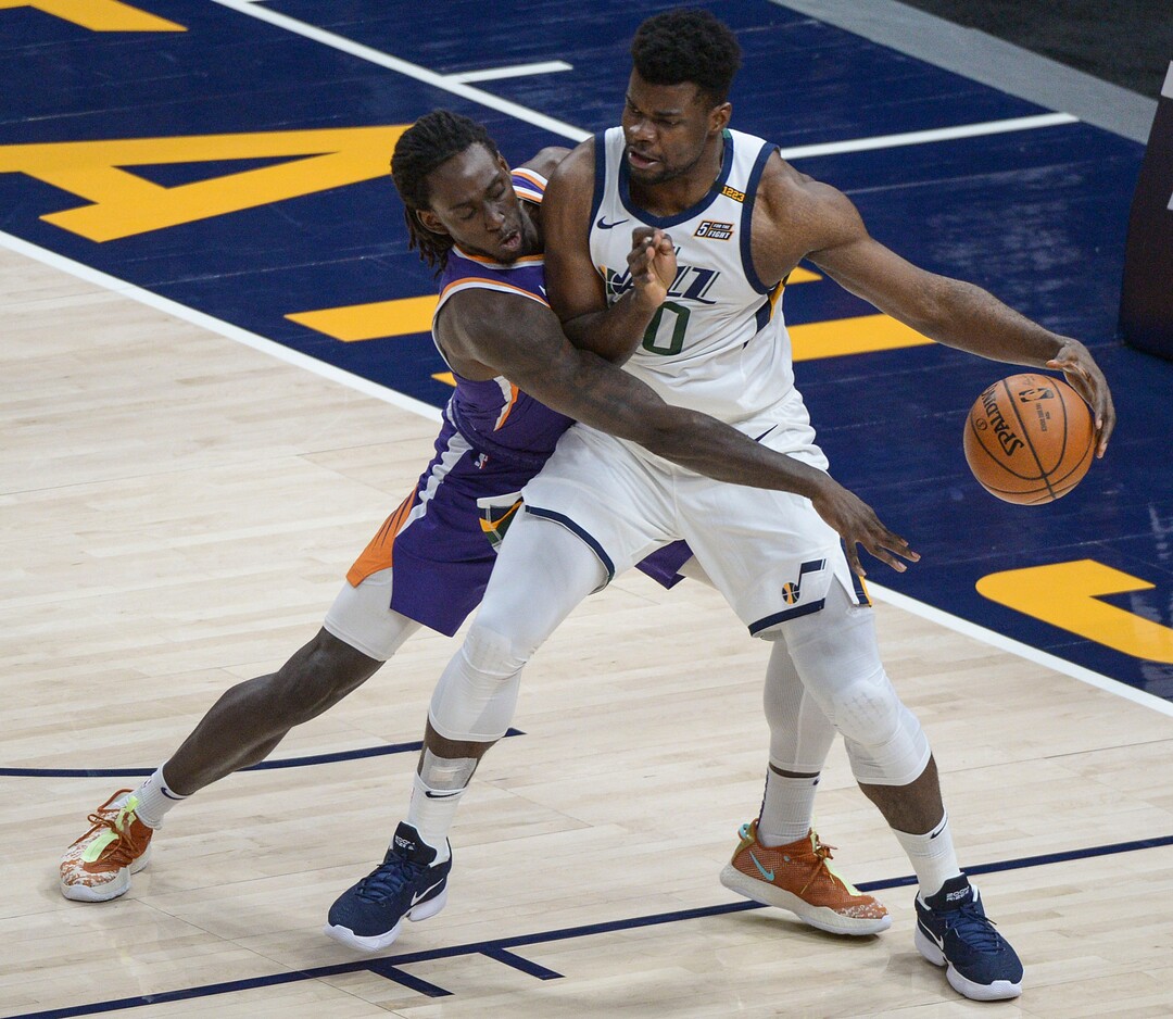 (Leah Hogsten  |  The Salt Lake Tribune) Phoenix Suns forward Johnathan Motley (12) pressures Utah Jazz center Udoka Azubuike (20) as the Jazz crack open their 2020-21 preseason with their second game against the Phoenix Suns, Dec. 14, 2020.