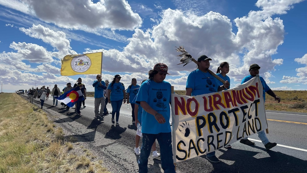 (Alastair Lee Bitsóí | The Salt Lake Tribune) Protesters march to close the White Mesa Mill on October 9, 2021.