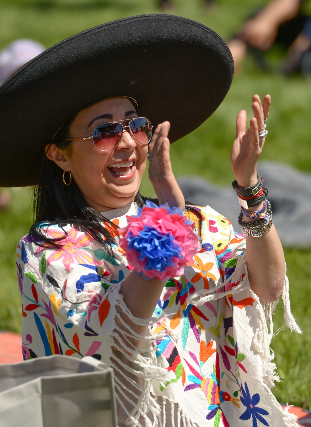 (Leah Hogsten  |  The Salt Lake Tribune) Claudia Mendez claps and dances to the "Guadalajara Dance" at the Cinco de Mayo Celebration, Saturday, May 5, 2018 at Centennial Park in West Valley City.