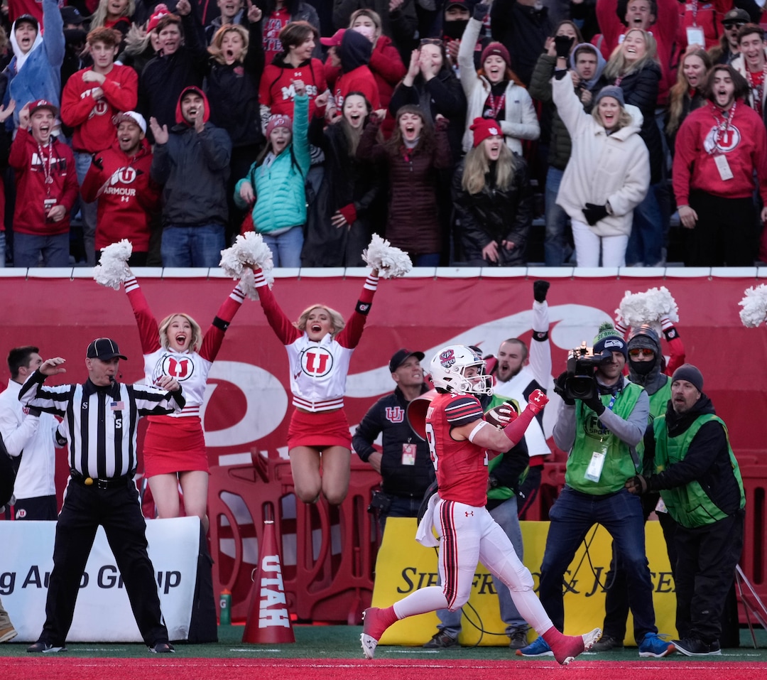 (Francisco Kjolseth | The Salt Lake Tribune) Utah Utes wide receiver Britain Covey (18) scores his final touchdown of the home game season as the University of Utah hosts the Colorado Buffaloes in Pac-12 football, Friday, Nov. 26, 2021 at Rice-Eccles Stadium.