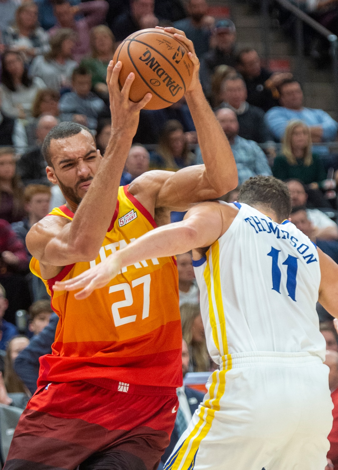 (Rick Egan  |  The Salt Lake Tribune)   Utah Jazz center Rudy Gobert (27) tries to get past Golden State Warriors guard Klay Thompson (11), in NBA action between Utah Jazz and Golden State Warriors, in Salt Lake City, Wednesday, Dec. 19, 2018.