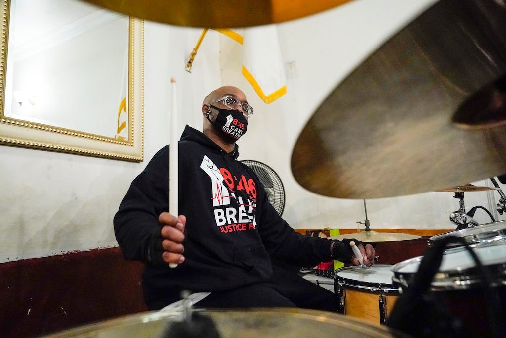 (Frank Franklin II | The Associated Press) Terrence Floyd, brother of George Floyd, plays the drums with other artists during a recording session for an album of protest songs with the Rev. Kevin McCall Monday, Dec. 28, 2020, in New York. A full album of songs is set for release in May, one year after George Floyd’s death at the hands of police in Minneapolis. Billed as the first album of its kind, the project follows a long history of racial justice messages and protest slogans crossing over into popular music and culture.
