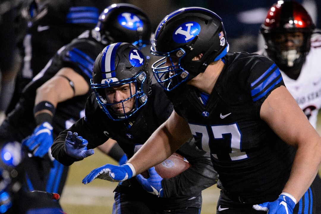 (Trent Nelson  |  The Salt Lake Tribune) Brigham Young Cougars running back Lopini Katoa (4) runs the ball as BYU hosts San Diego State, NCAA football in Provo on Saturday, December 12, 2020.