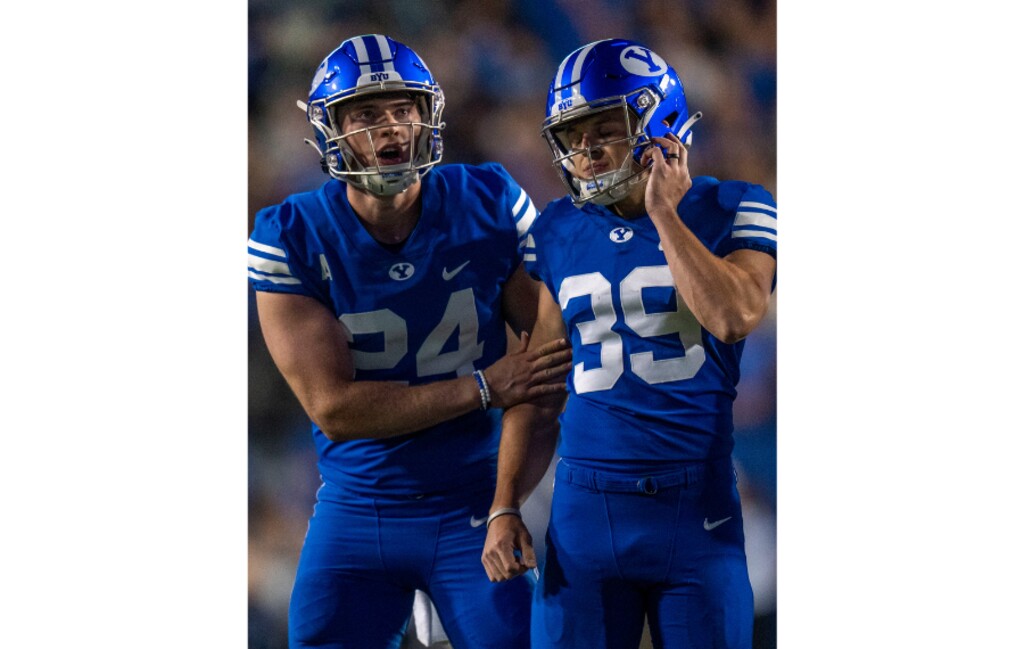 (Rick Egan | The Salt Lake Tribune)  Brigham Young Cougars punter Ryan Rehkow (24) consoles Cougars place kicker Jake Oldroyd (39) after he missed his kick, in overtime in football action between the Brigham Young Cougars and the Baylor Bears at LaVell Edwards Stadium in Provo, on Saturday, Sept. 10, 2022.