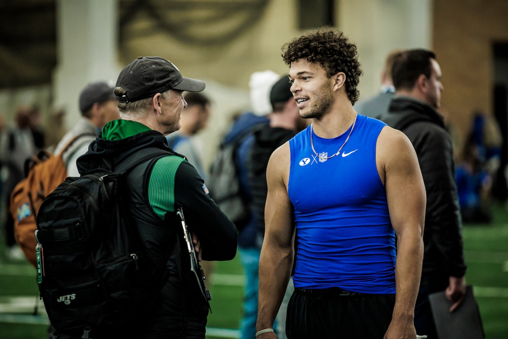 (Photography by Nate Edwards | BYU) Jaren Hall talks with a New York Jets scout at BYU's pro day on March 24, 2023.