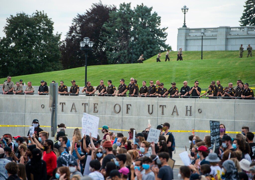 (Rick Egan  |  Tribune file photo) Police observe a protest from across the street on the grounds of the Utah Capitol on Thursday, June 4, 2020.