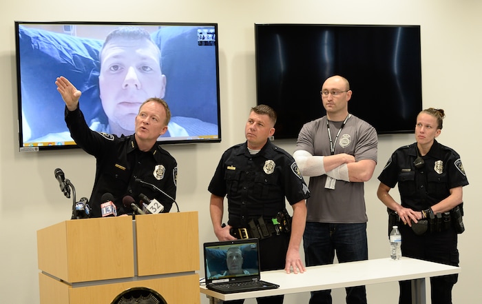 (Francisco Kjolseth  |  The Salt Lake Tribune)  Kaysville Police Chief Sol Oberg, left, describes the surveillance footage from a gas station convenience store where a suicidal subject call on April 5, 2018, injured officers  Robert Jackson, on screen, recovering at the University Hospital burn unit,  Sgt. Shawn McKinnon, center, and officers Cade Bradshaw and Lacy Turner. The four officers responded to a man who entered a Chevron gas station store and doused himself with gasoline. As the officers tried to get a lighter from the manÕs hand, the man lit himself on fire.