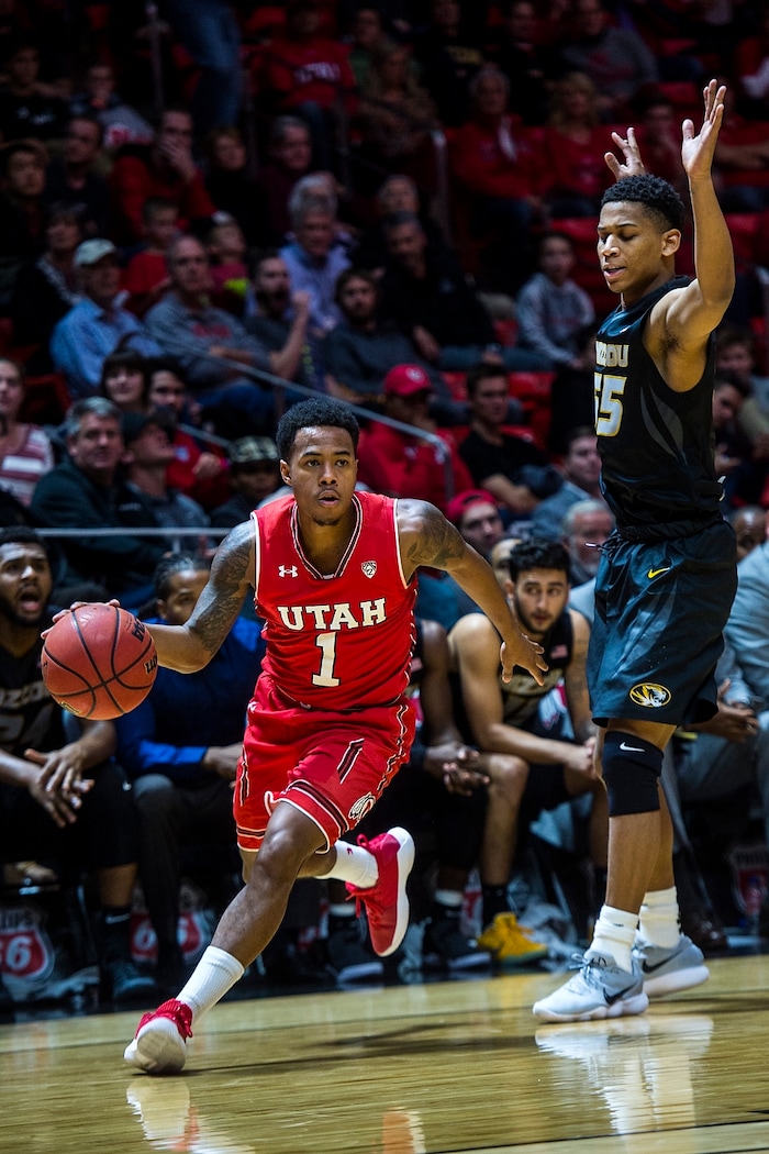 (Chris Detrick  |  The Salt Lake Tribune)  Utah Utes guard Justin Bibbins (1) runs past Missouri Tigers guard Blake Harris (55) during the game at the Jon M. Huntsman Center Thursday, November 16, 2017.   