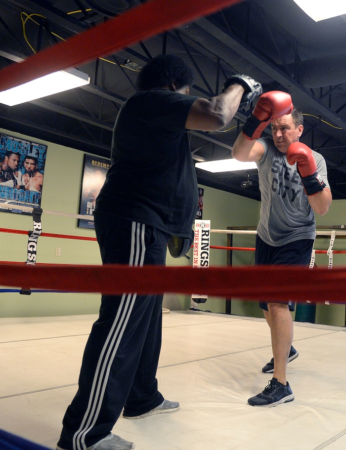 (Al Hartmann | The Salt Lake Tribune)
House Speaker Greg Hughes spars with Eddie "Flash" Newman during his workout at the Flash Academy gym in Holladay Tuesday August 29. He's among a handful of local politicians, police and lobbyists who will box in a series of charity matches to benefit a national group that works to end domestic violence.