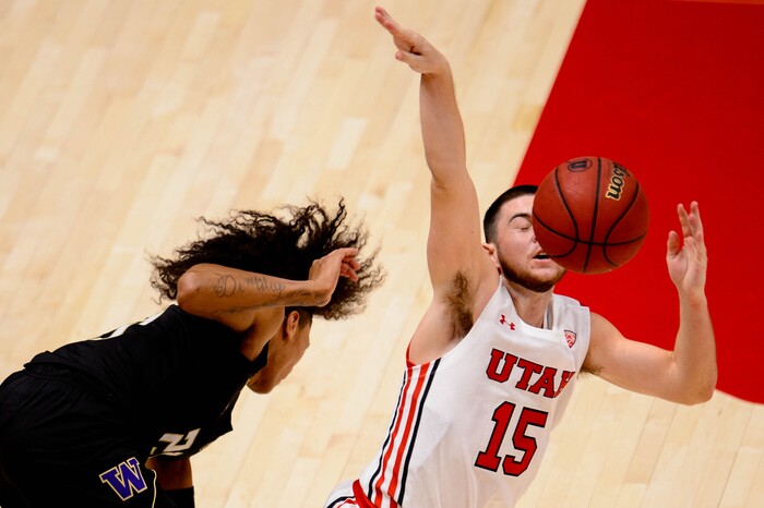 (Trent Nelson | The Salt Lake Tribune) Utah's Rylan Jones is fouled by Washington's Raequan Battle as Utah hosts Washington, NCAA basketball in Salt Lake City on Thursday, Dec. 3, 2020.