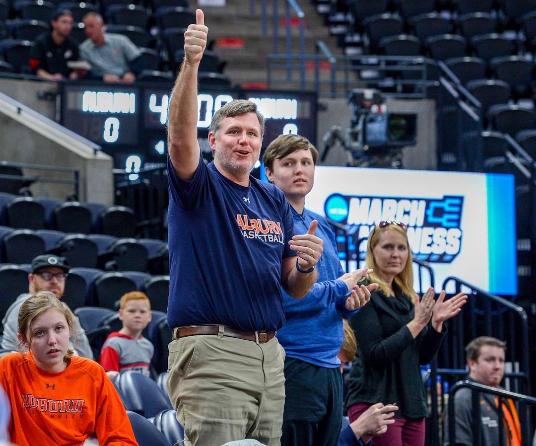 Leah Hogsten  |  The Salt Lake Tribune Getting a chance to watch Auburn practice on Wednesday before they caught a flight home was pure luck for the Whitt family of Montgomery, AL. The Auburn basketball season ticket holders were skiing in Park City on vacation for the week when they found out that Auburn would be practicing on Wednesday in preparation for their NCAA Division I Men's Basketball Championship game against New Mexico. l-r Maggie, Murry, Casey, Hudson and CeCe Whitt cheer Auburn as they leave the court. 