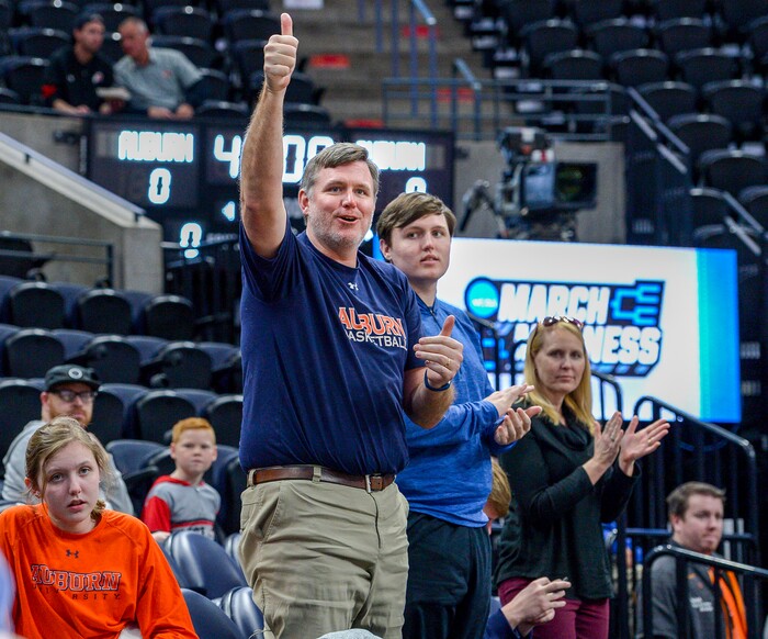 Leah Hogsten  |  The Salt Lake Tribune Getting a chance to watch Auburn practice on Wednesday before they caught a flight home was pure luck for the Whitt family of Montgomery, AL. The Auburn basketball season ticket holders were skiing in Park City on vacation for the week when they found out that Auburn would be practicing on Wednesday in preparation for their NCAA Division I Men's Basketball Championship game against New Mexico. l-r Maggie, Murry, Casey, Hudson and CeCe Whitt cheer Auburn as they leave the court. 