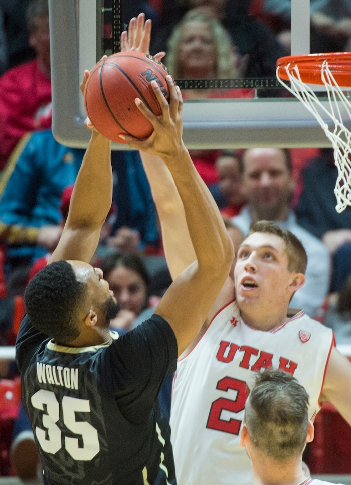 (Rick Egan  |  The Salt Lake Tribune)  Utah Utes forward Tyler Rawson (21) defends asColorado Buffaloes forward Dallas Walton (35) shoots , in PAC-12 basketball action at the Jon M. Huntsman Center, Saturday, March 3, 2018.