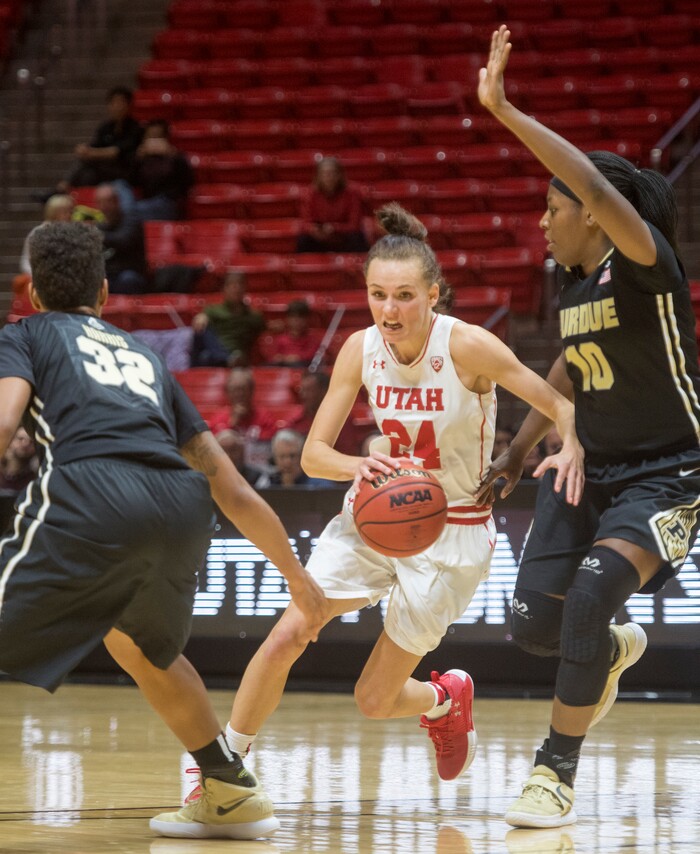 (Rick Egan  |  The Salt Lake Tribune) Utah Utes guard/forward Tilar Clark (24) splits defenders, Purdue Boilermakers forward Ae'Rianna Harris (32) and Andreona Keys (10), in basketball action Utah Utes vs. Purdue Boilermakers, at the Jon M. Huntsman Center, Monday, Nov. 20, 2017.