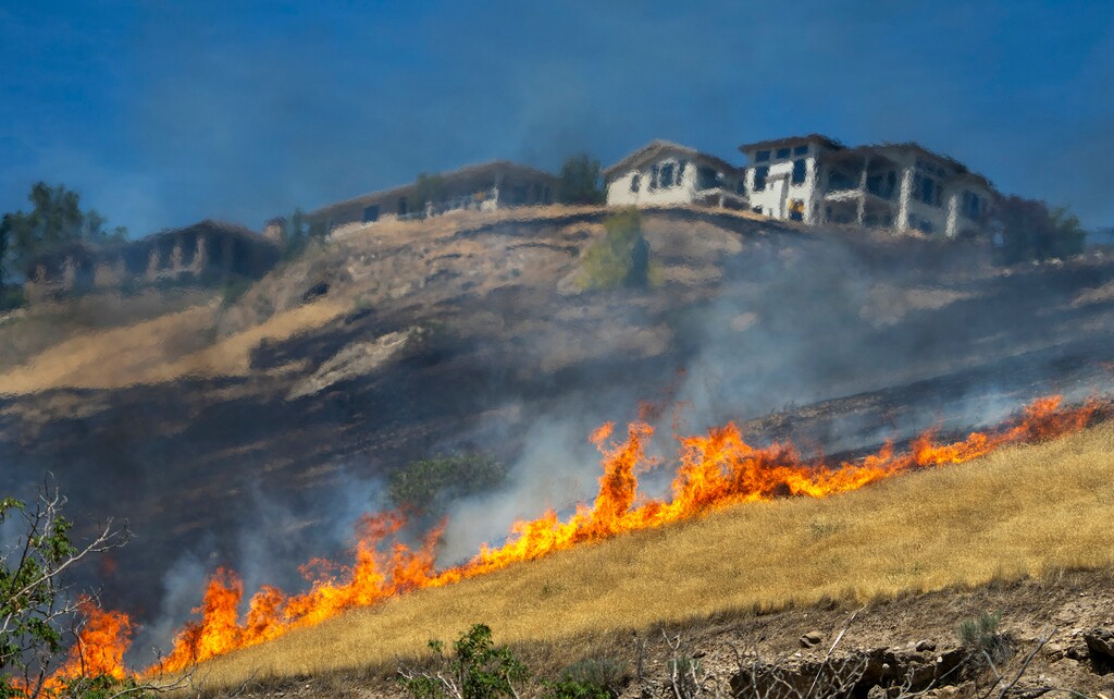(Rick Egan | The Salt Lake Tribune) Fire above Victory Road on Wednesday, June 10, 2026.