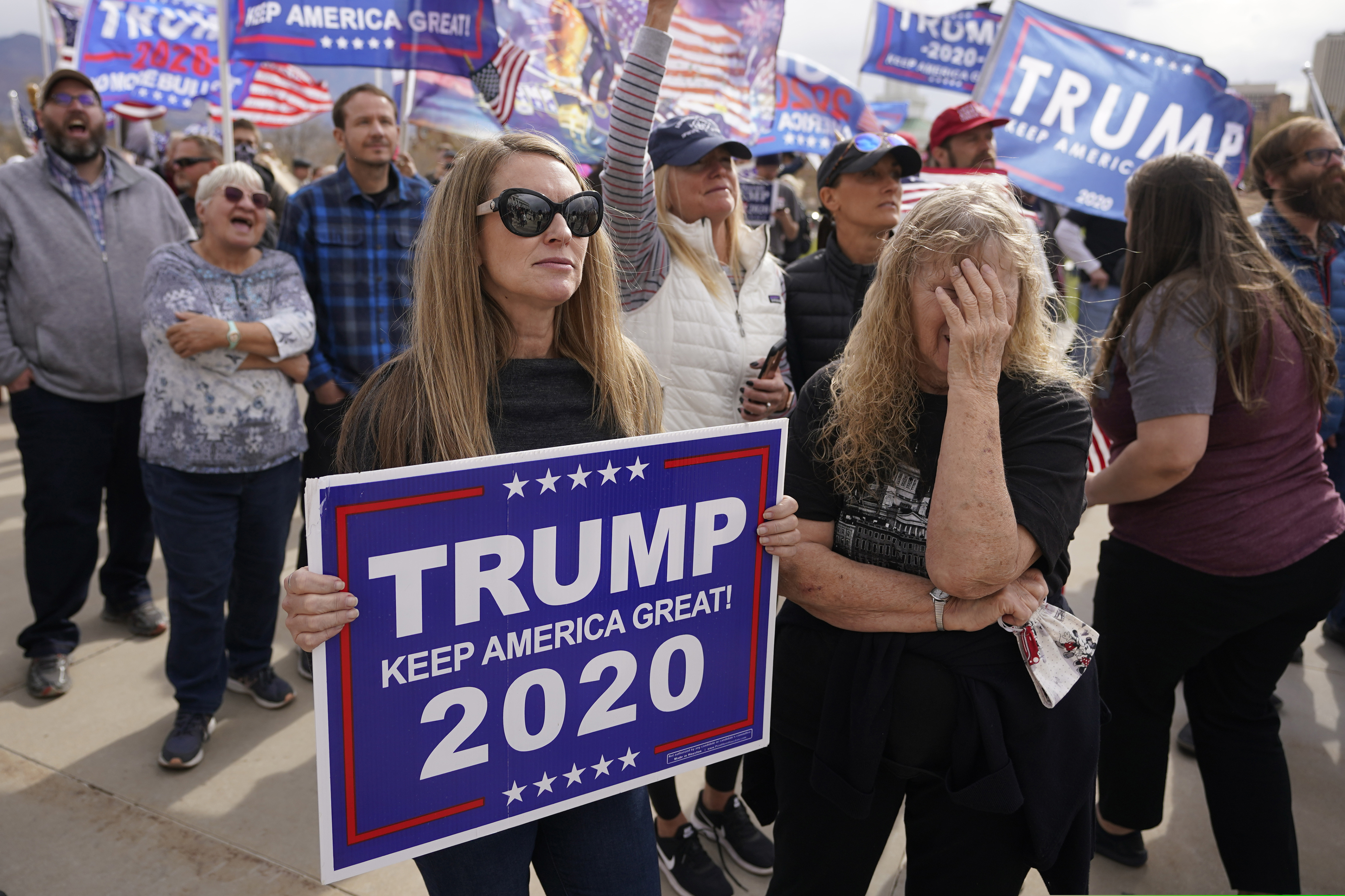 Supporters of President Donald Trump stage a rally outside the Utah State Capitol Saturday, Nov. 7, 2020, in Salt Lake City. Democrat Joe Biden defeated President Donald Trump to become the 46th president of the United States on Saturday, positioning himself to lead a nation gripped by a historic pandemic and a confluence of economic and social turmoil. (AP Photo/Rick Bowmer)