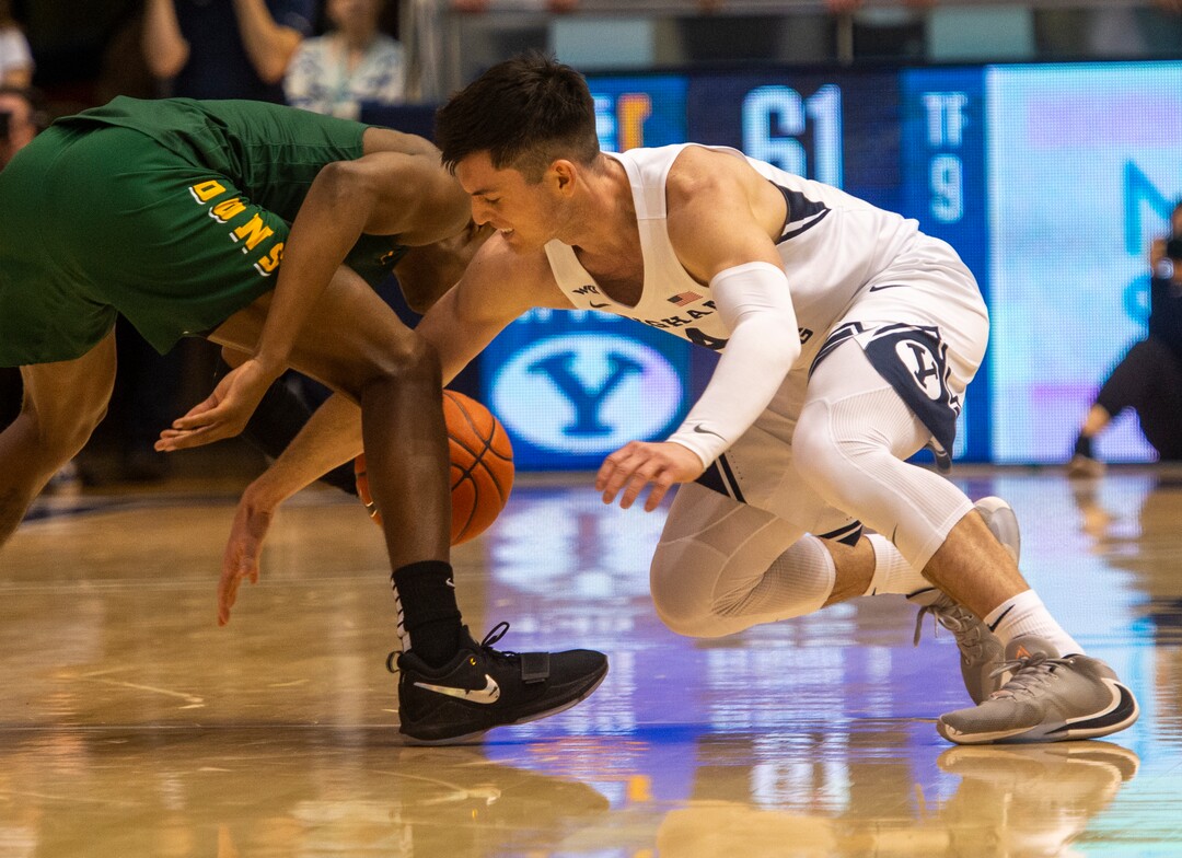 (Rick Egan  |  The Salt Lake Tribune)    Brigham Young Cougars guard Alex Barcello (4) goes for a loose ball along with San Francisco Dons guard Jamaree Bouyea (1), in WCC basketball acton between the Brigham Young Cougars and the San Francisco Dons, at the Marriott Center, Saturday, Feb. 8, 2020.