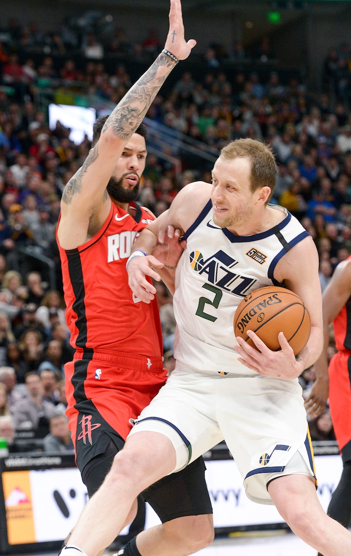 (Leah Hogsten  |  The Salt Lake Tribune) Utah Jazz guard Joe Ingles (2) battles Houston Rockets guard Austin Rivers (25) to get to the net.  The Utah Jazz host the Houston Rockets at Vivint Arena, Feb. 22, 2020.