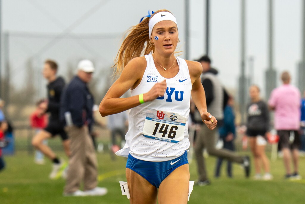 (Rick Egan | The Salt Lake Tribune) BYU runner Jane Hedengren runs through the crowds of spectators in first place in the NCAA cross country regional championships at the Regional Athletic Complex in Salt Lake City, on Friday, Nov. 14, 2025.