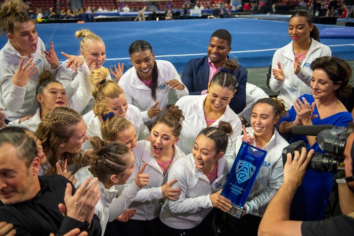 (Rick Egan  |  The Salt Lake Tribune)    The UCLA Bruins receive the first place trophy for the PAC-12 Gymnastics Championship at the Maverik Center, Saturday, March 23, 2019.



