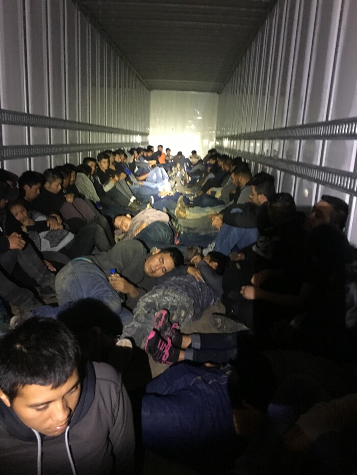 This Jan. 26, 2018 photo provide by U.S. Customs and Border Protection taken near Loredo, Texas, shows a tractor-trailer filled with illiegal immigrants from Mexico, Honduras, El Salvador and Guatemala. Thirteen unaccompanied immigrant children were among those rescued in this event. The driver, a U.S. citizen, was arrested and the tractor-trailer was seized by Border Patrol. (U.S. Customs and Border Protection via AP)